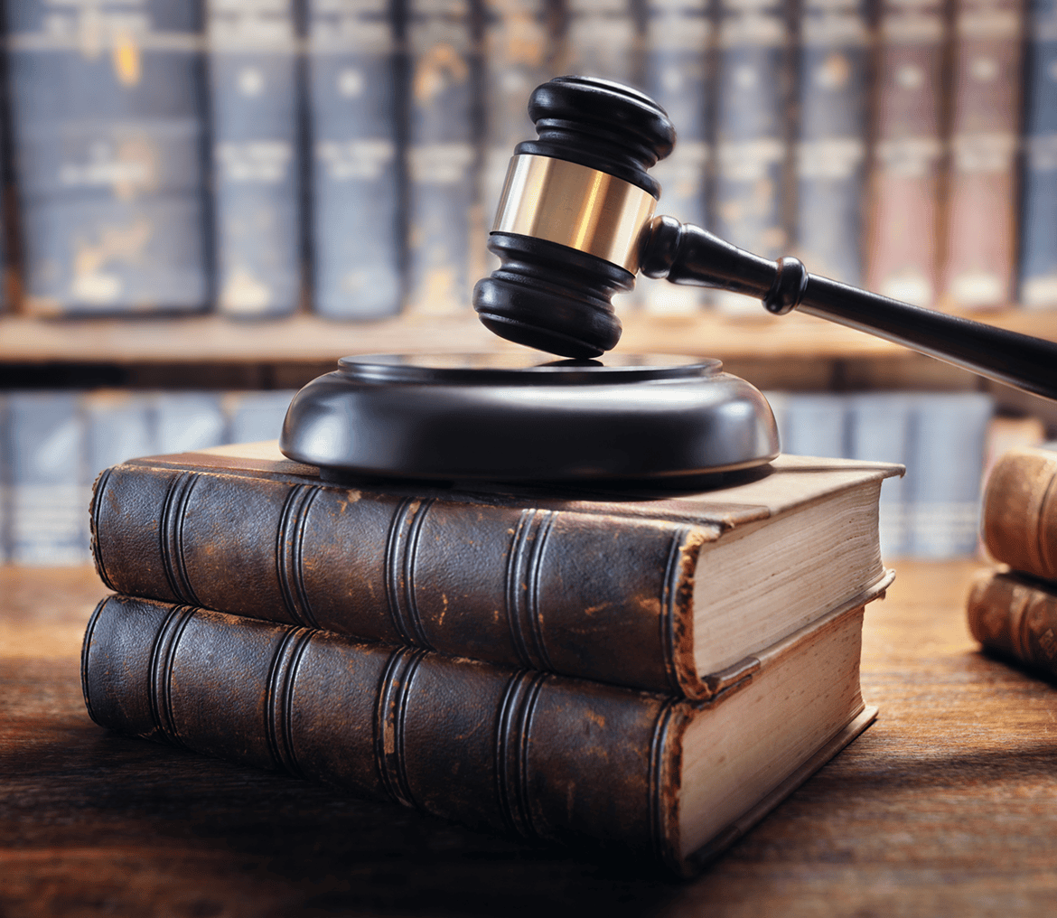 Gavel resting on stacked law books