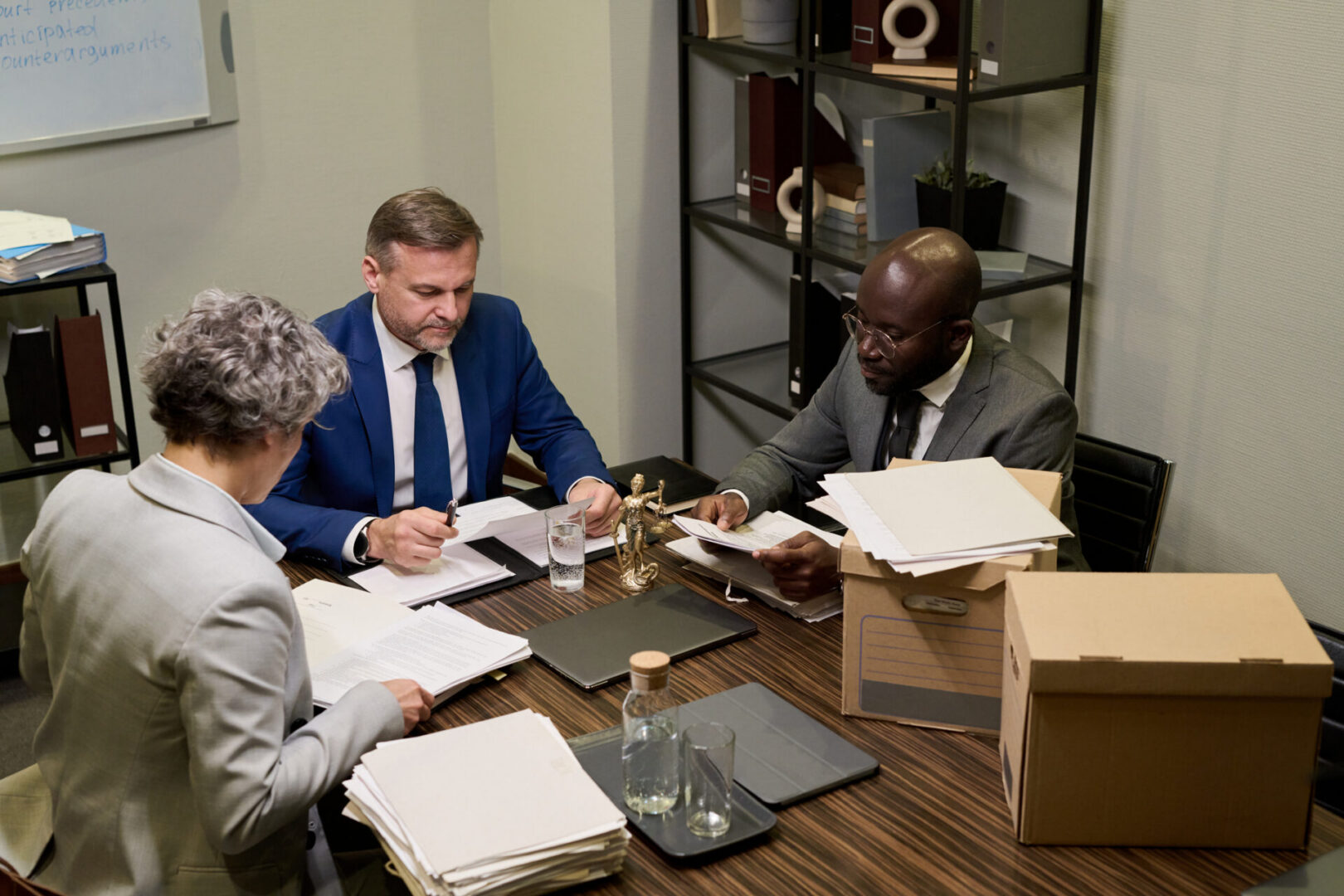 Colleagues collaborating over paperwork and files