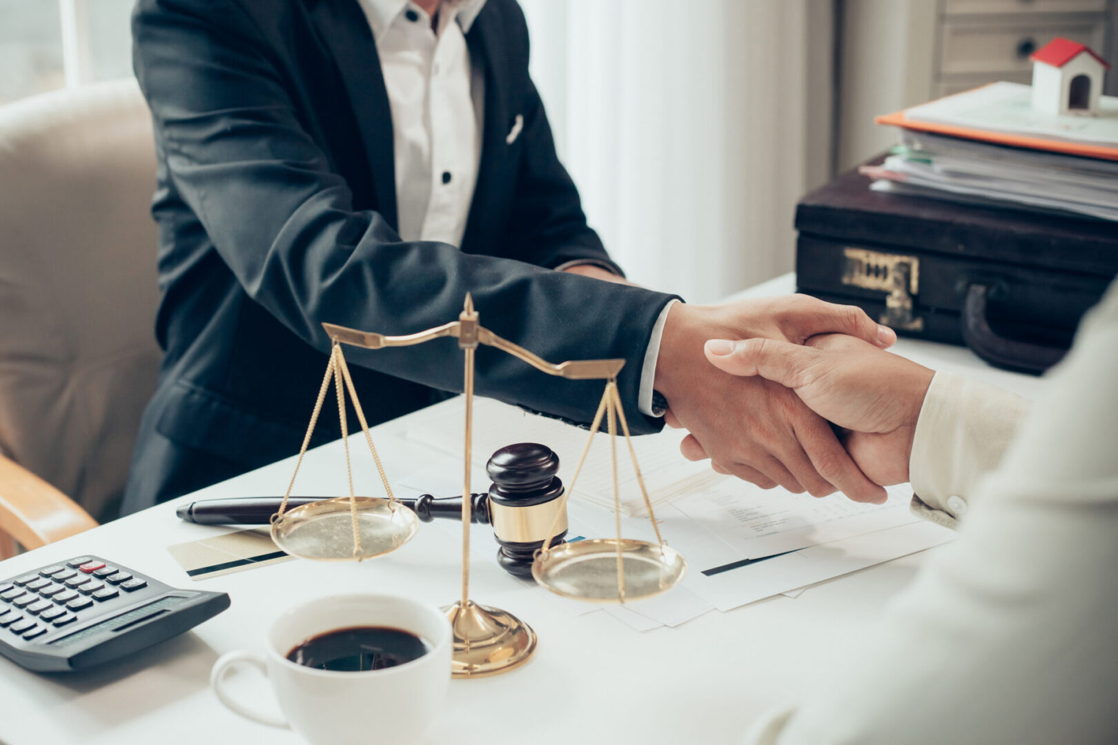 Handshake over a legal agreement
